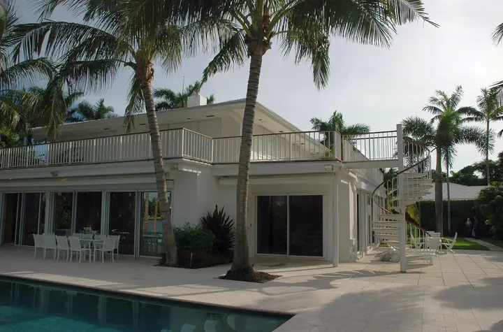 A white villa among palm trees